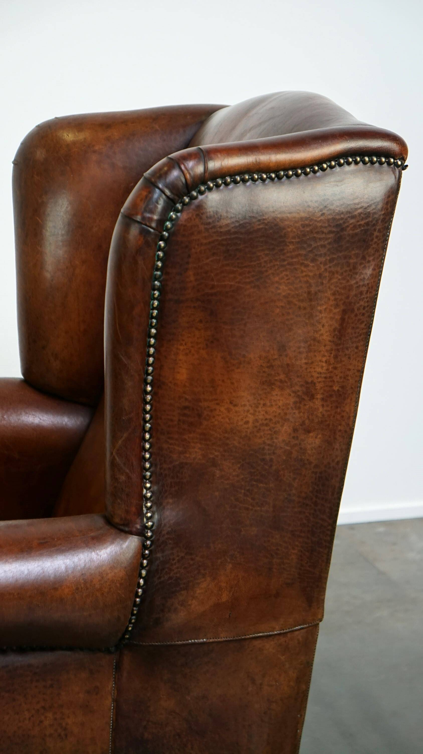 Large sheepskin wing chair with excellent colour and great seating comfort