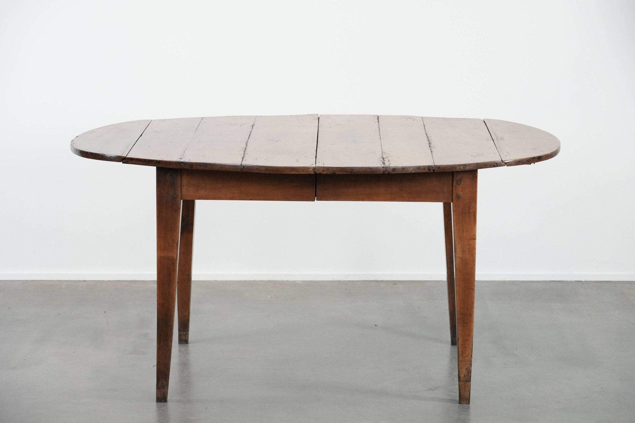 Rare antique oval French extendable dining table made of fruitwood