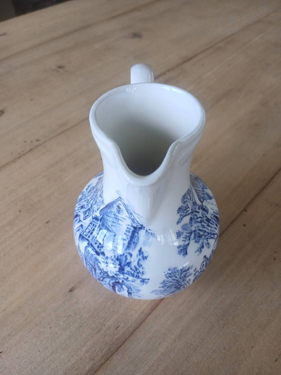 Small old pitcher in iron earth