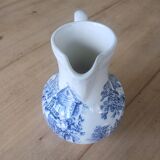Small old pitcher in iron earth
