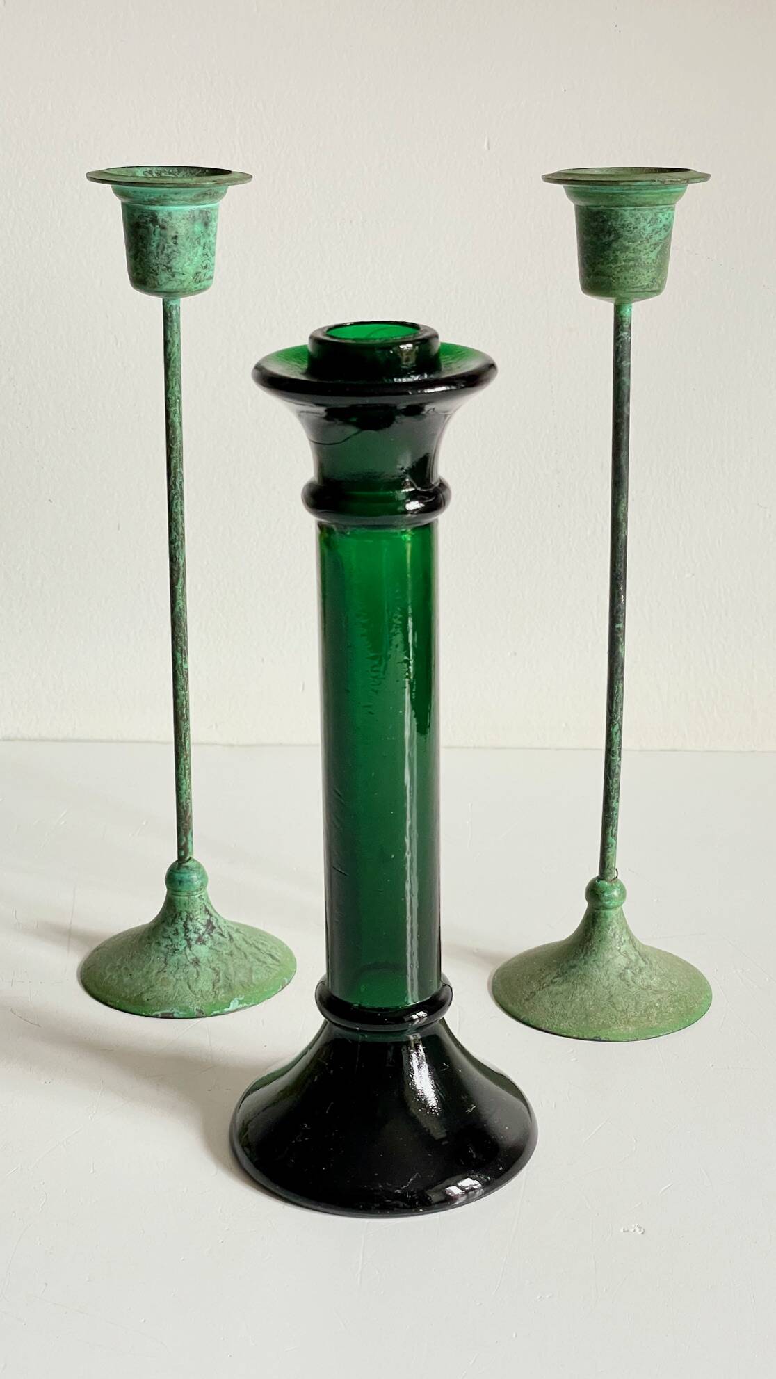 Green glass and metal candle holders