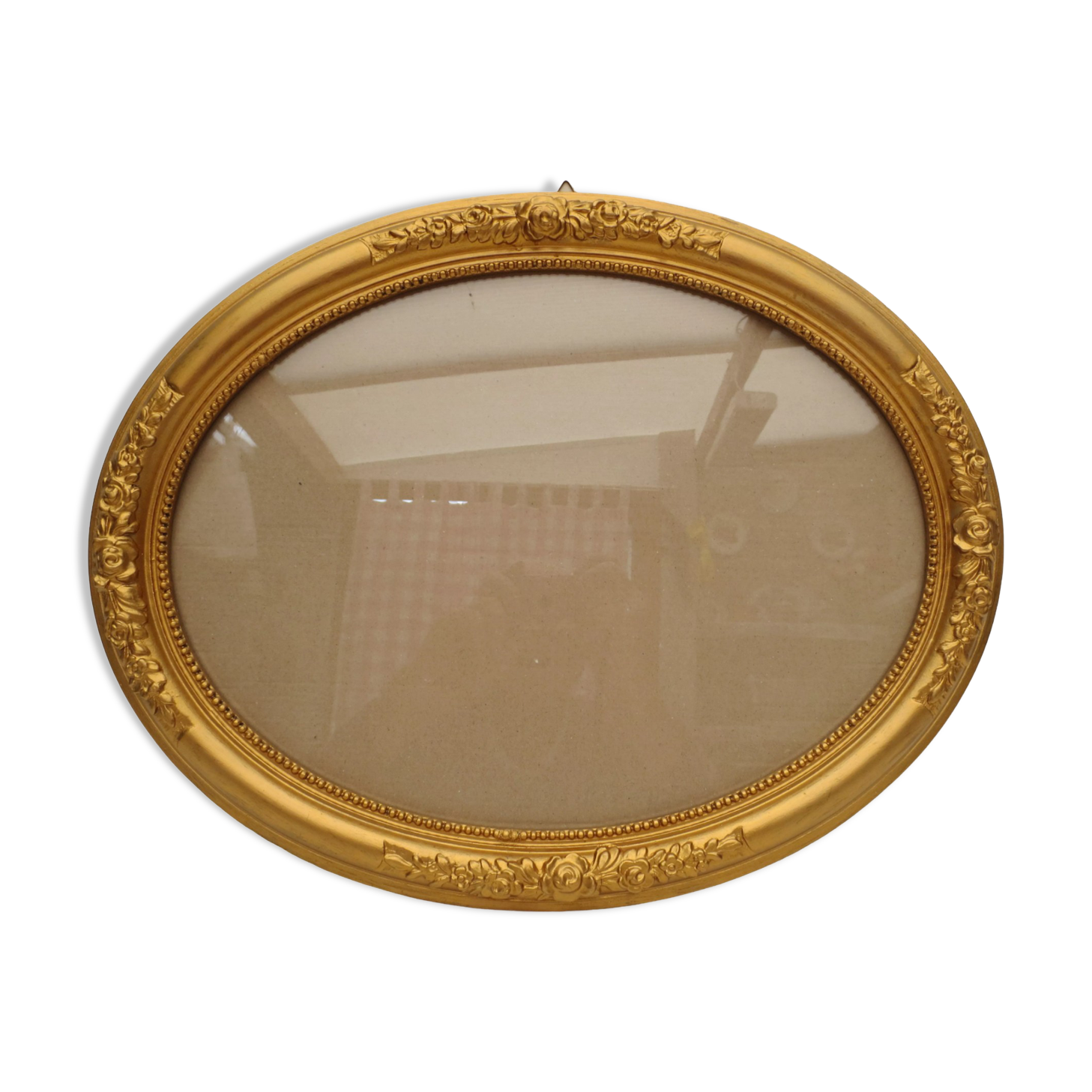 Large old oval gilded wooden frame and stucco decorations