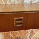 Suspended teak bedside tables in vintage 1960s Scandinavian style.