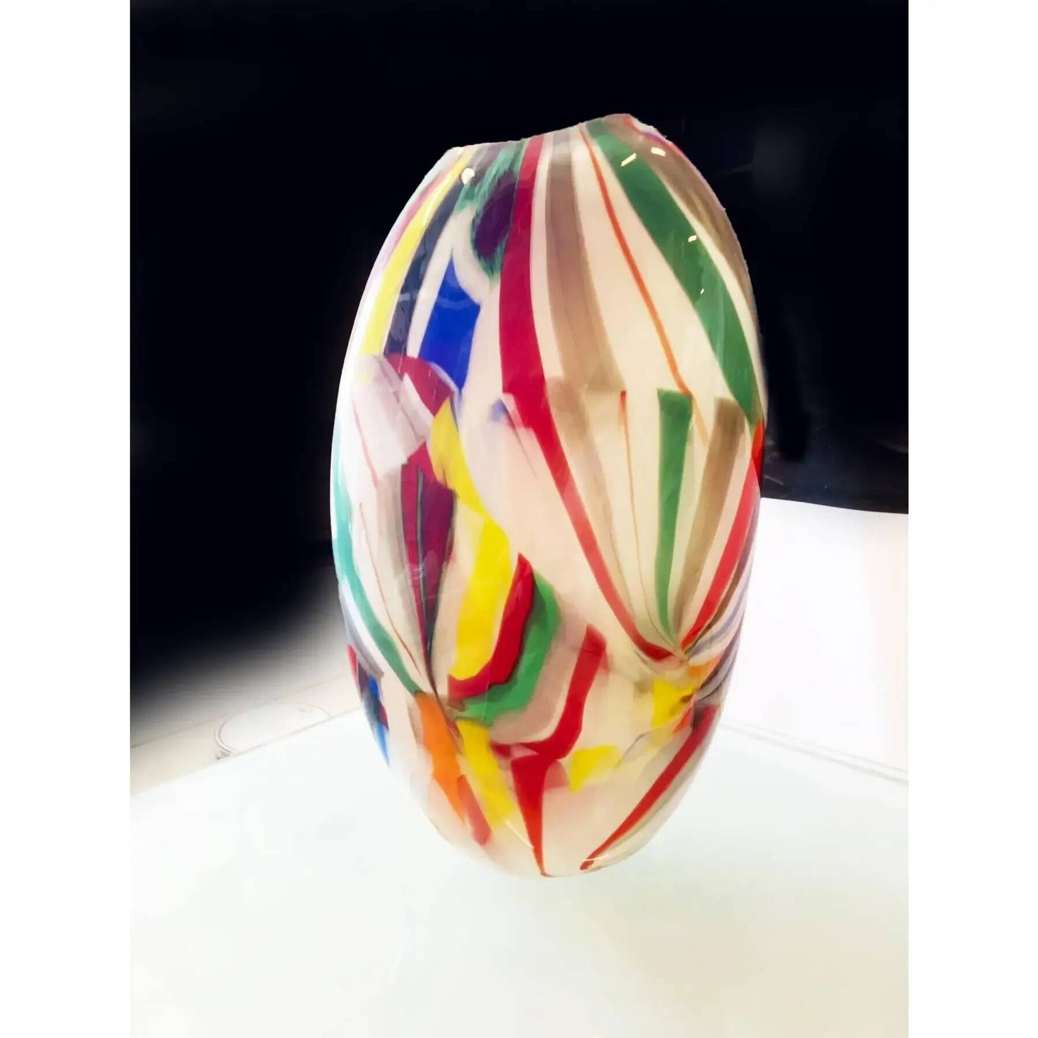 Abstract vase in milky-white Murano-inspired glass with multicoloured reeds.