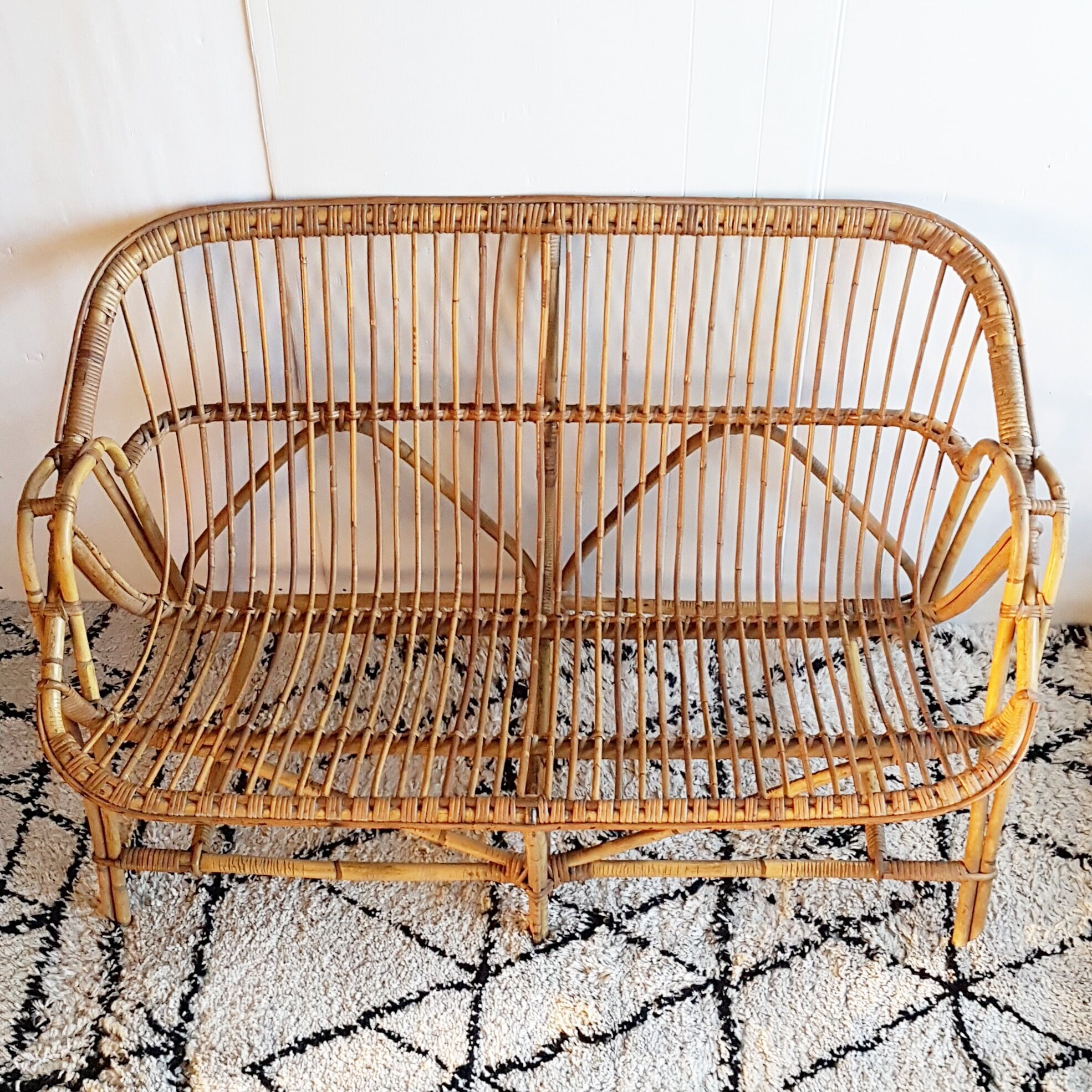 Bench into rattan of the 1960s