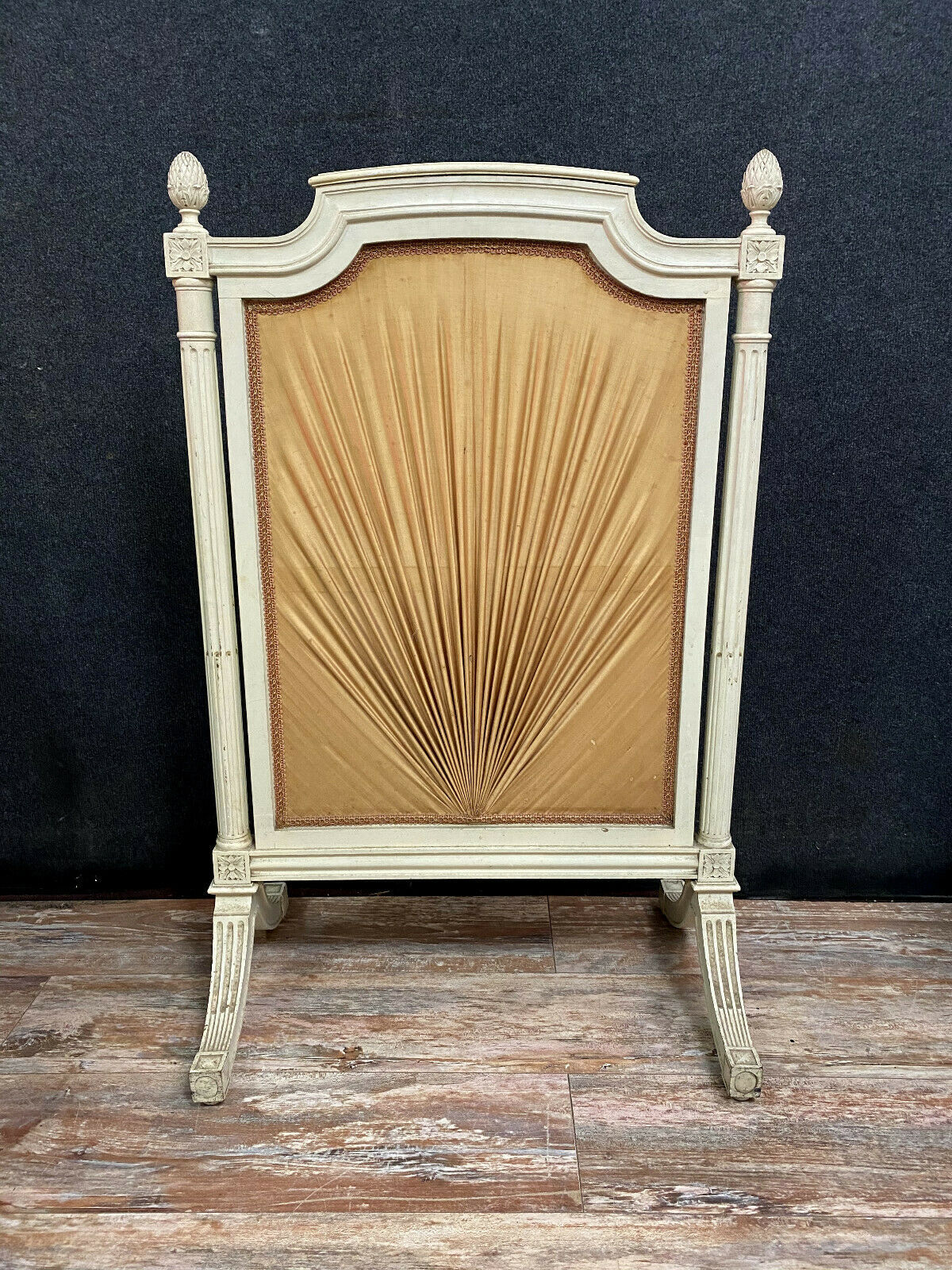 Front of Louis XVI fireplace in laqué wood and fabric has floral decorations