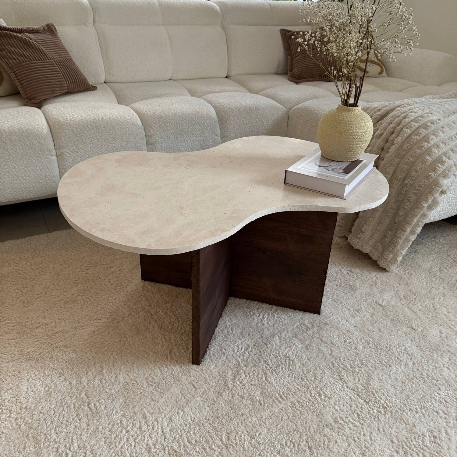 Cloud coffee table in travertine and dark oak.