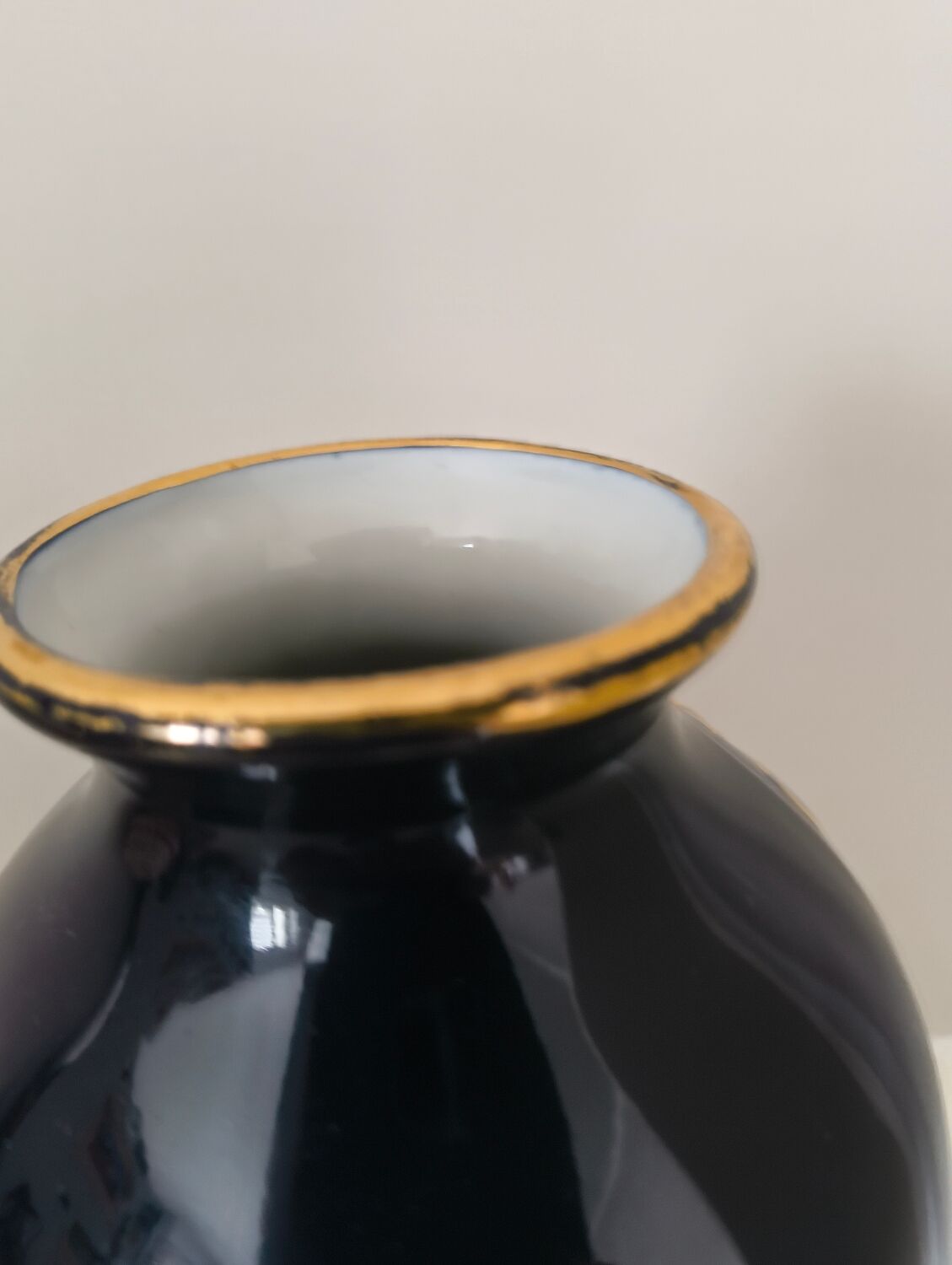 Cobalt blue porcelain vase from Limoges, France with floral pattern.