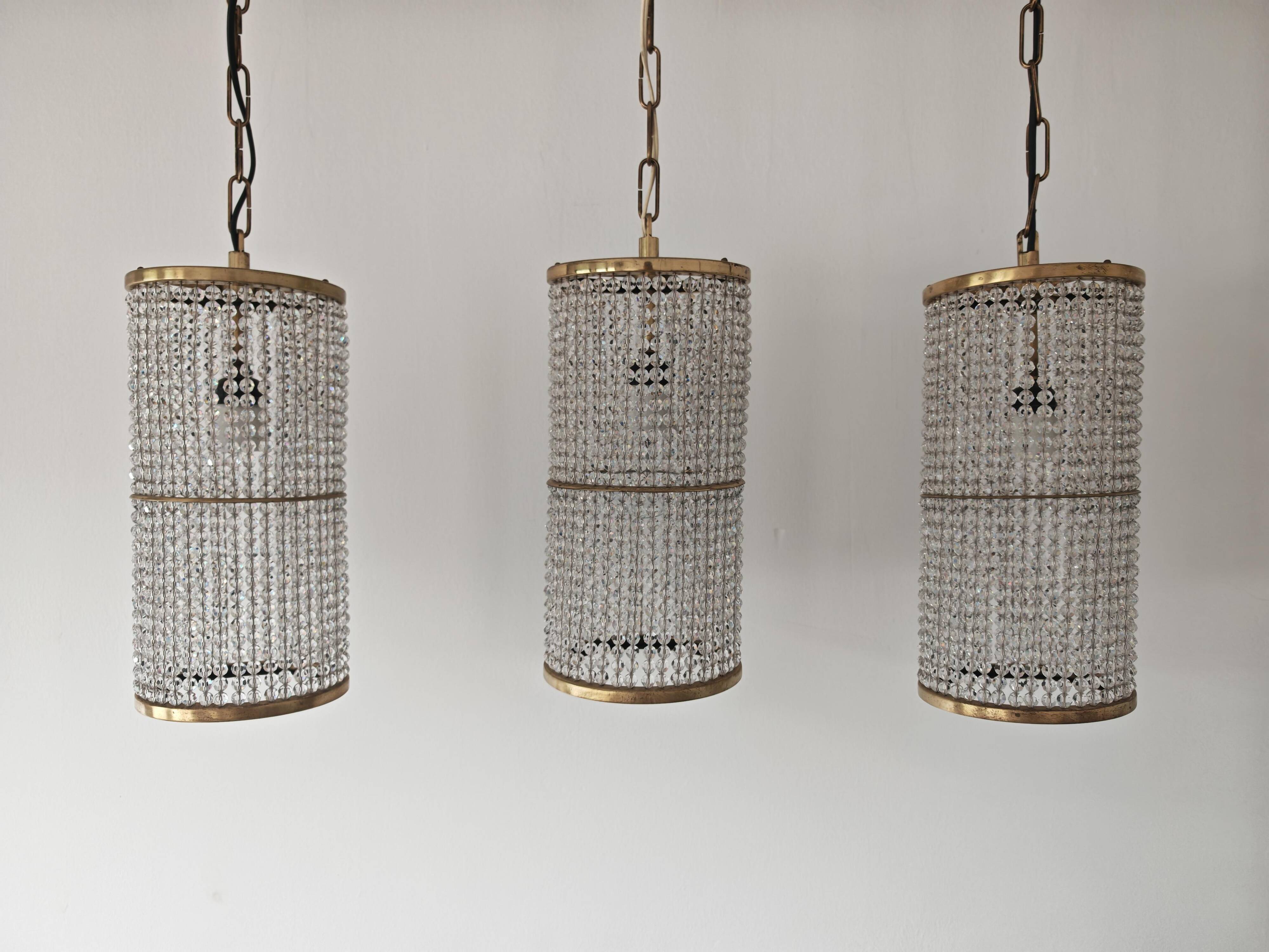 Set of 3 cylindrical crystal chandeliers in mid-century modern style attributed to Lobmeyr.