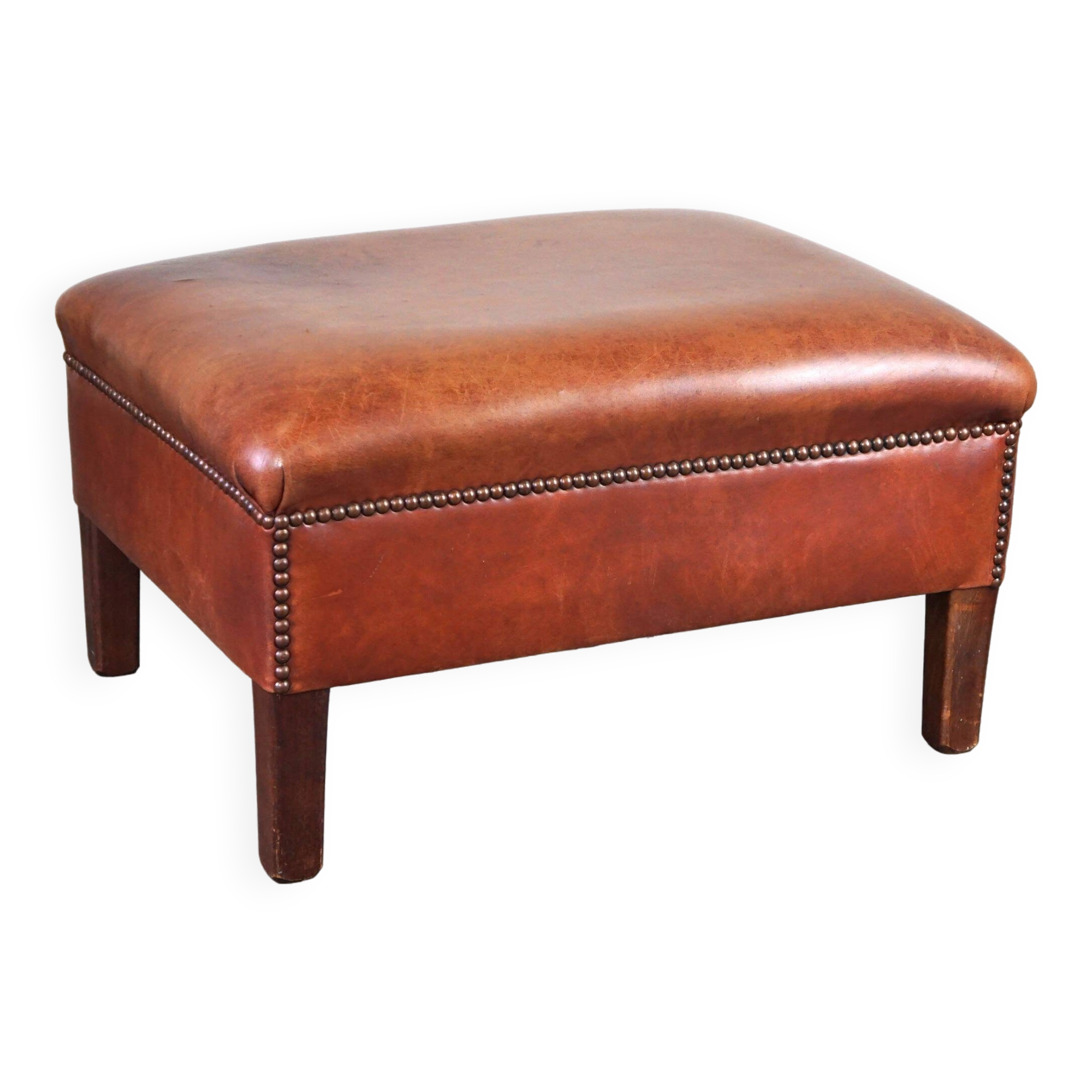 Leather ottoman in classic English style finished with decorative nails