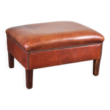 Leather ottoman in classic English style finished with decorative nails