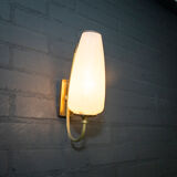Ornate wall lamp made of milk glass and brass