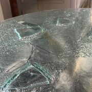 Pair of round coffee tables, glass, ca 1970