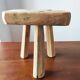 Vintage Danish brutalist tripod stool made of solid oak.