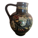 Large glazed terracotta pitcher with floral decoration