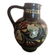Large glazed terracotta pitcher with floral decoration
