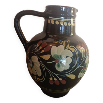 Large glazed terracotta pitcher with floral decoration