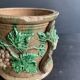 Large 19th century slip pot with vine decoration