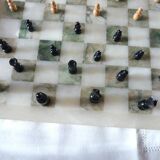 Onyx chessboard and complete wooden chess set.