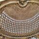 Antique rococo chair in gilded wood and caning