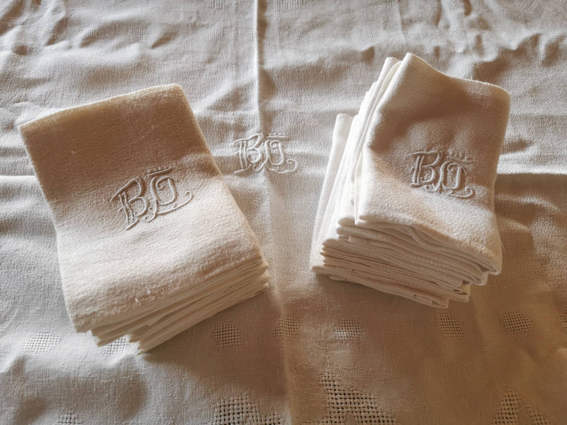 Set of 16 table napkins and an old floral damask tablecloth.
