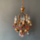 Antique chandelier in gilded sheet metal and red and white crystal pendants, 1900