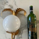 Pair of palm leaf wall lights in Hollywood Regency style with opaque globes by Hans Kögl, Germany, 1970s.