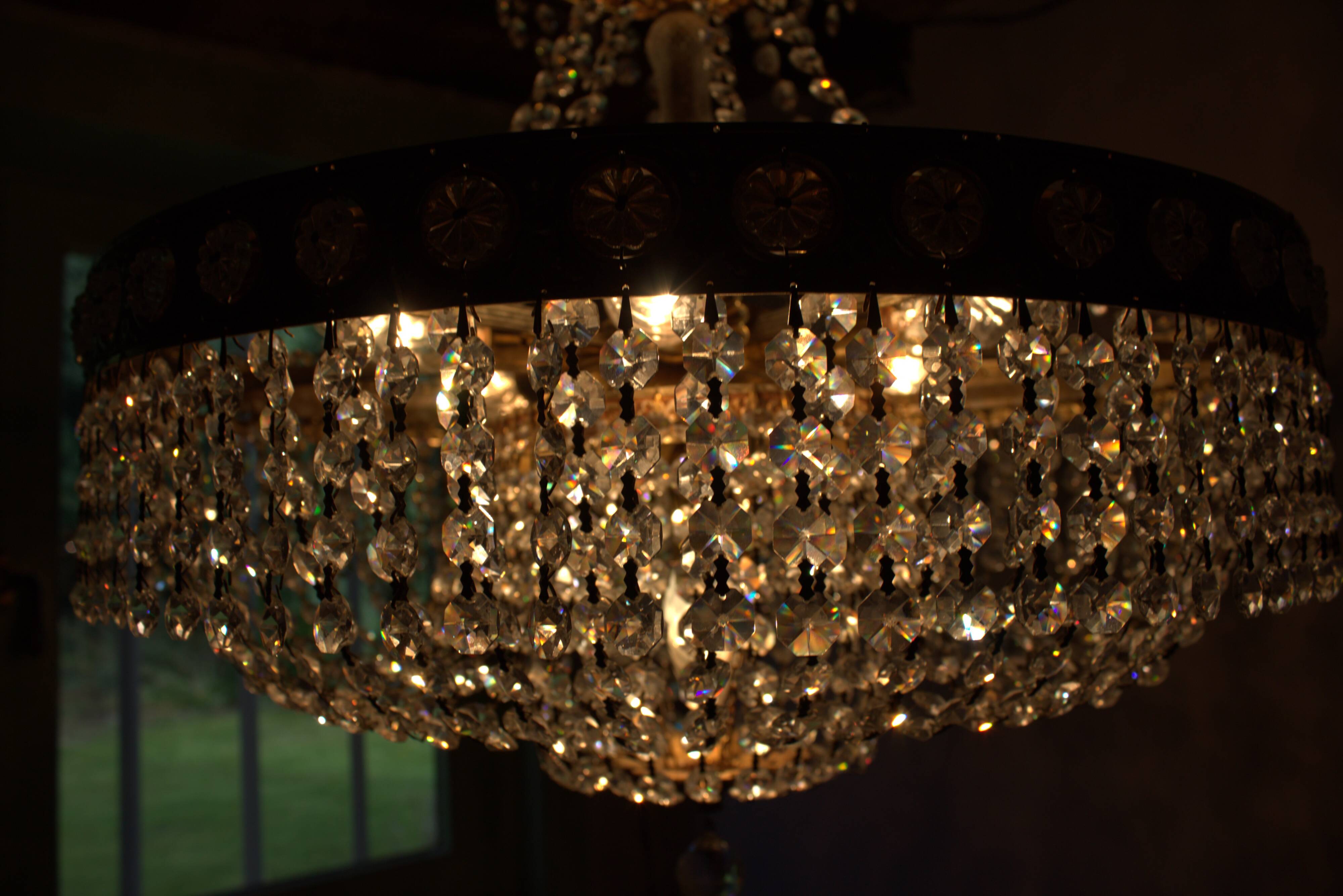 Antique castle style chandelier with tassels and floral details