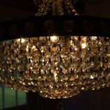 Antique castle style chandelier with tassels and floral details