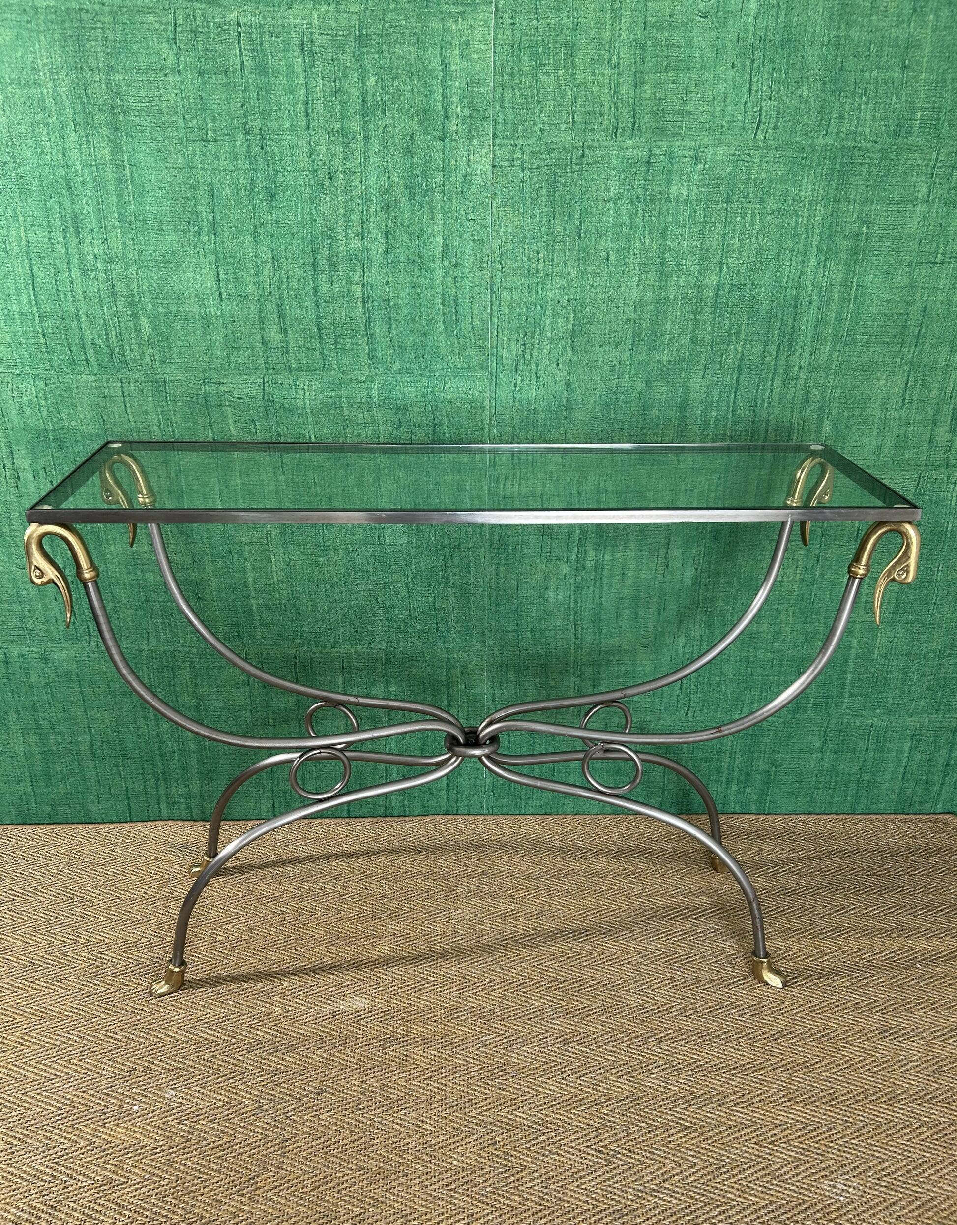 Polished steel and brass console, probably Maison Jansen, France, mid-century modern Hollywood Regency.