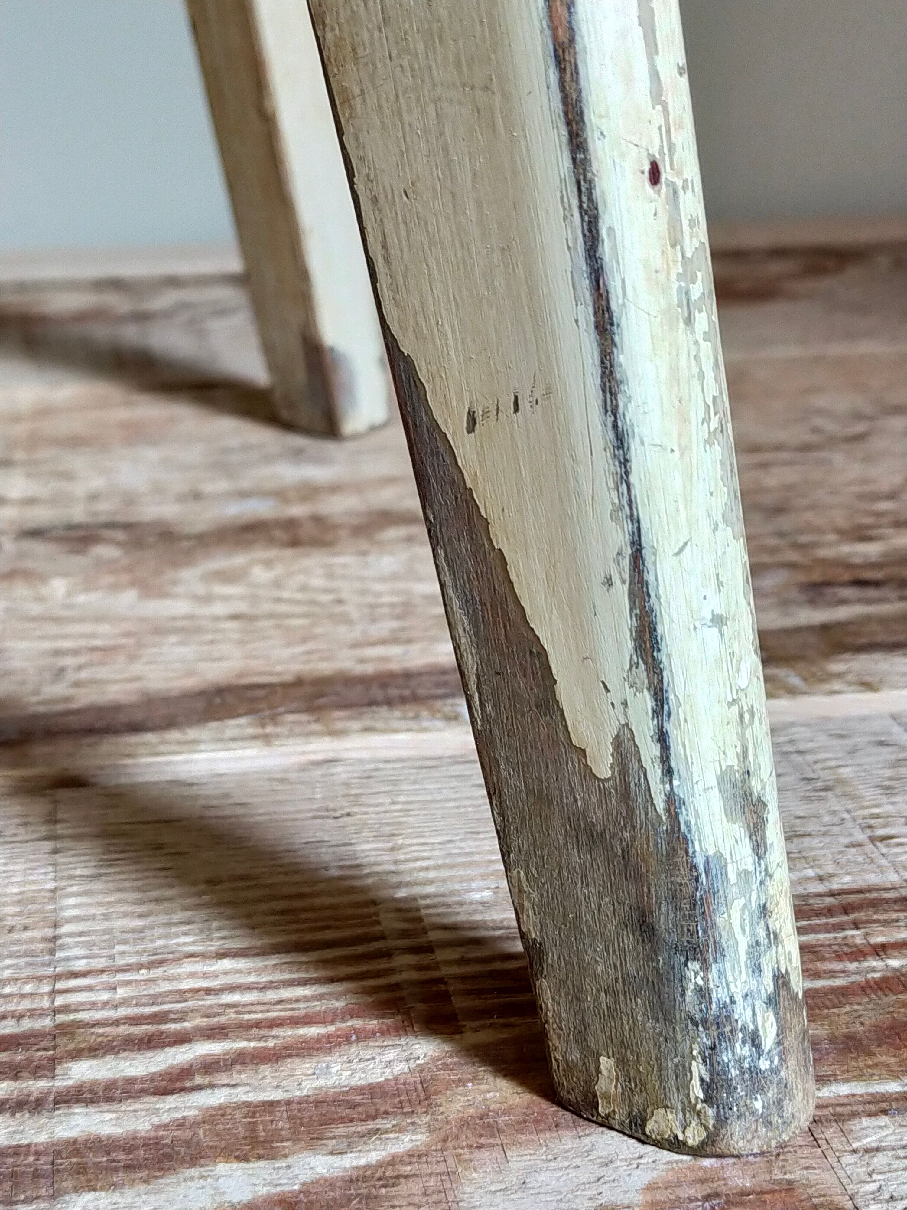 Old workshop stool in patinated solid wood