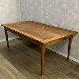 Dining table with tapered legs and solid exotic wood