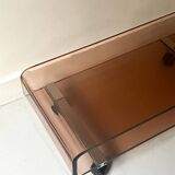 Smoked plexiglass coffee table on wheels, Roche Bobois design 1970.