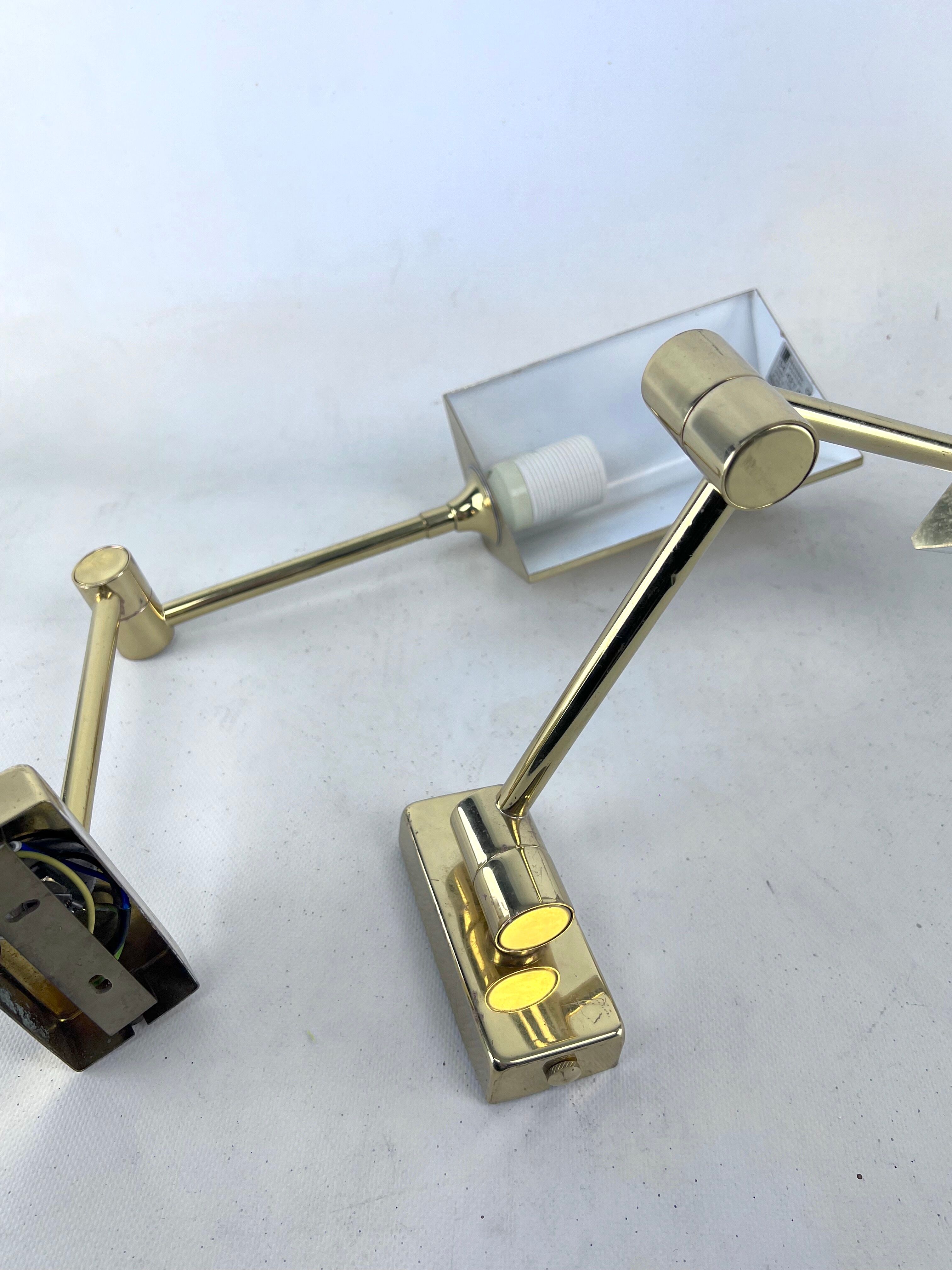 Postmodern pair of articulated brass wall lamps by Baulmann Leuchten. Germany 1980s