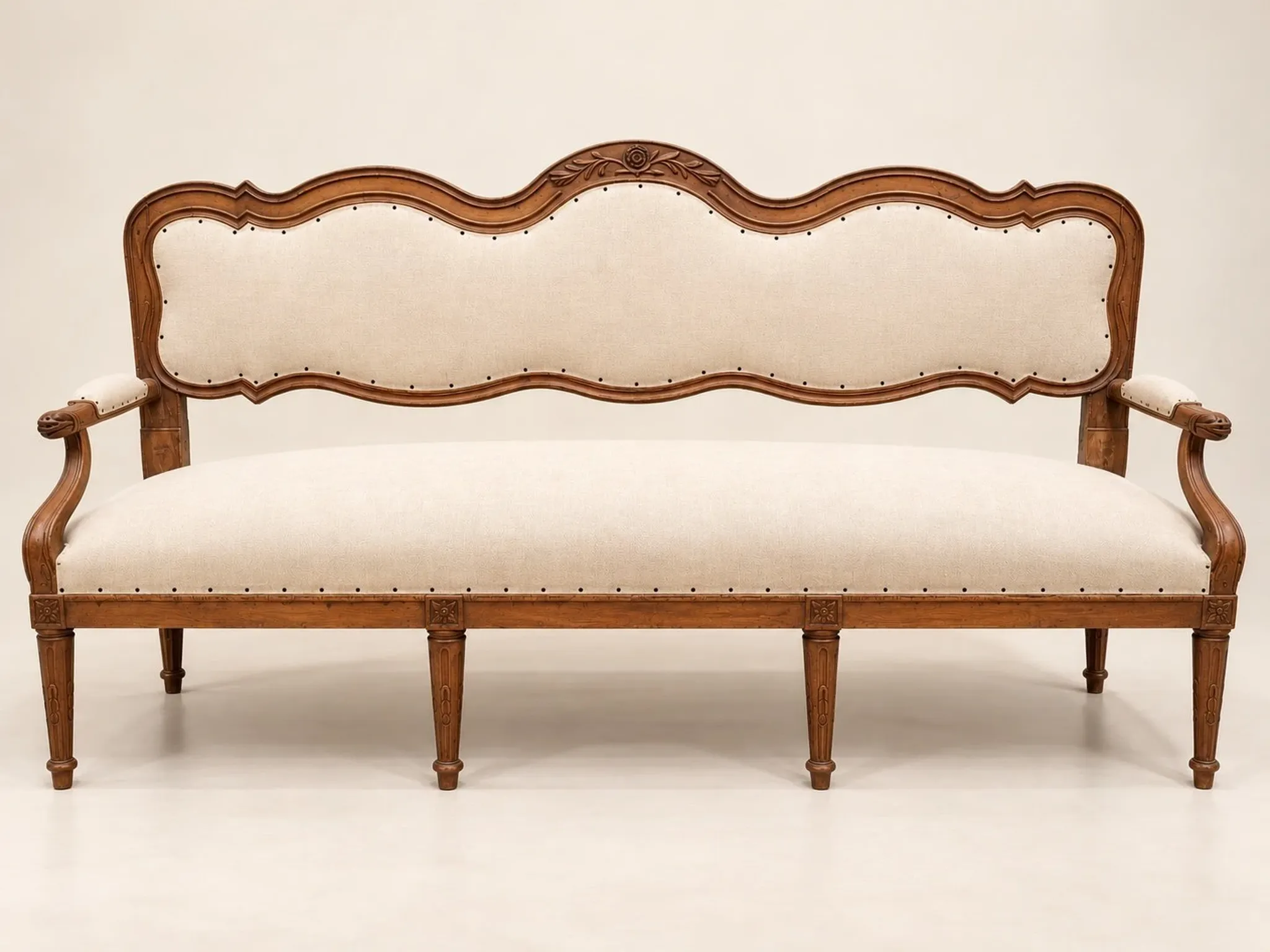 Louis XVI period canapé – Model with eel heads – Carved walnut
