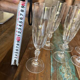 Set of 7 champagne flutes. Made of cut crystal.