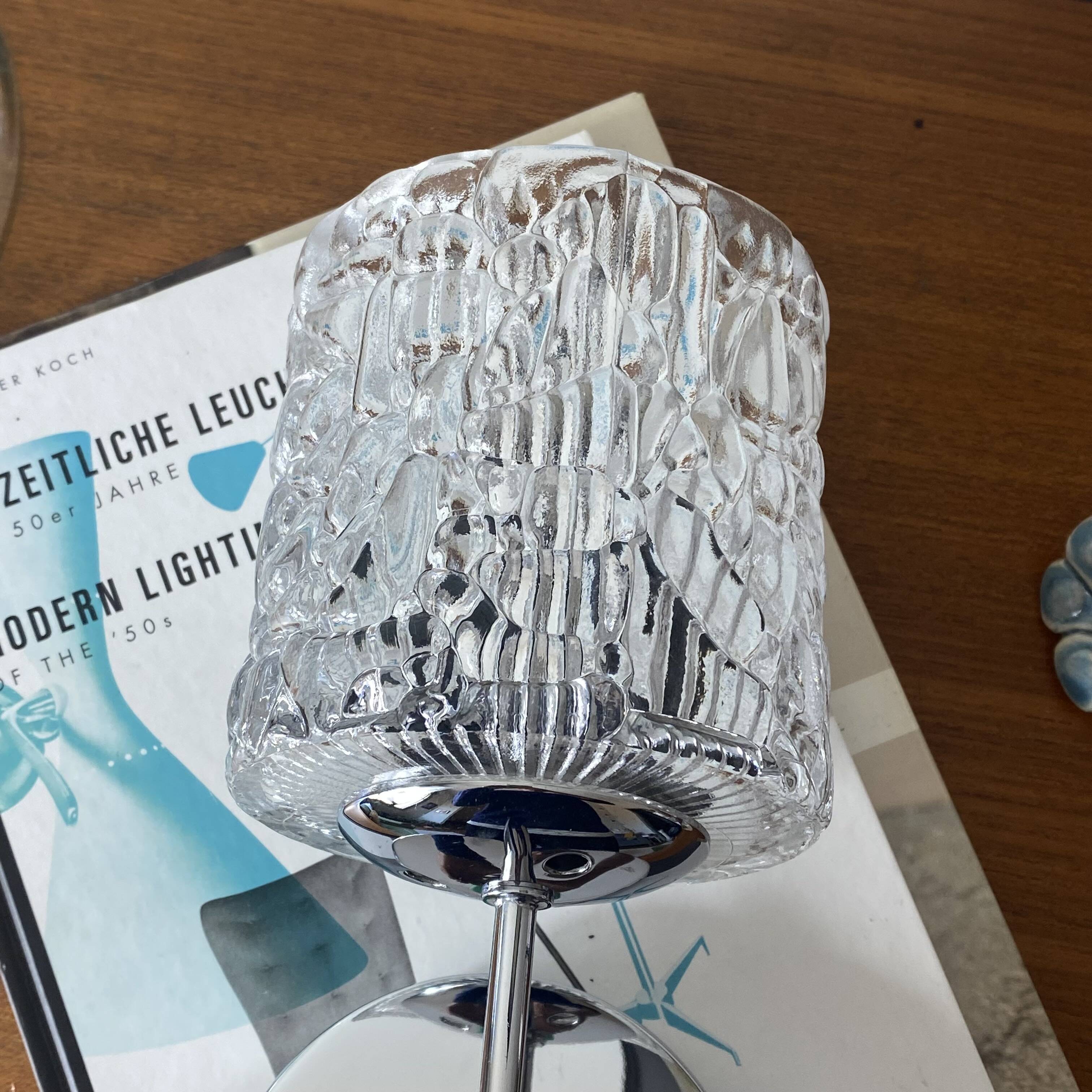 Swan neck wall light in stainless steel, thick glass shade, stainless steel rose.