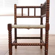 Antique Dutch oak corner chair with turned spindles and new rush seat