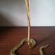 Candlestick mounted on brass cobra