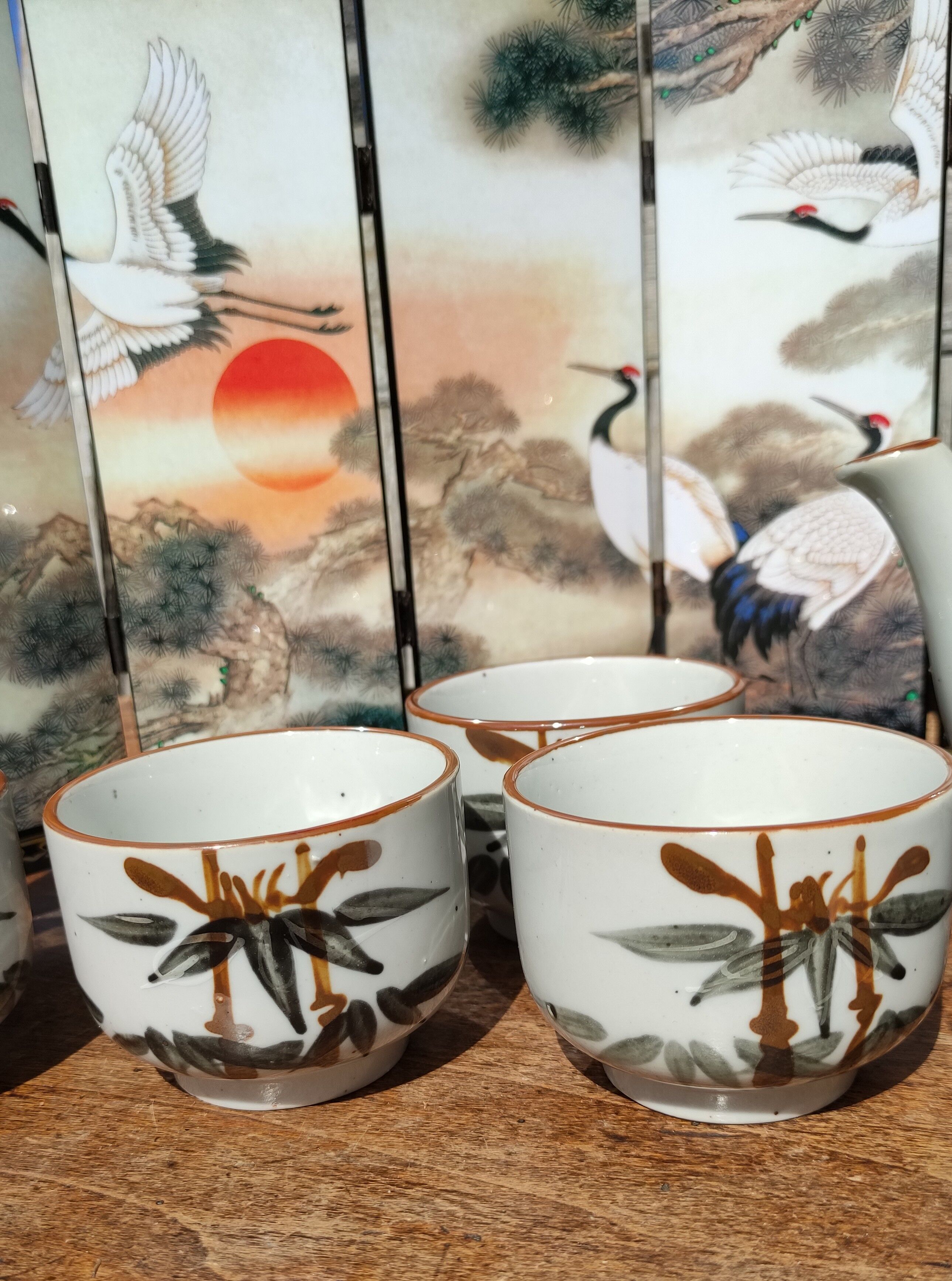 Asian set of a teapot and its cups
