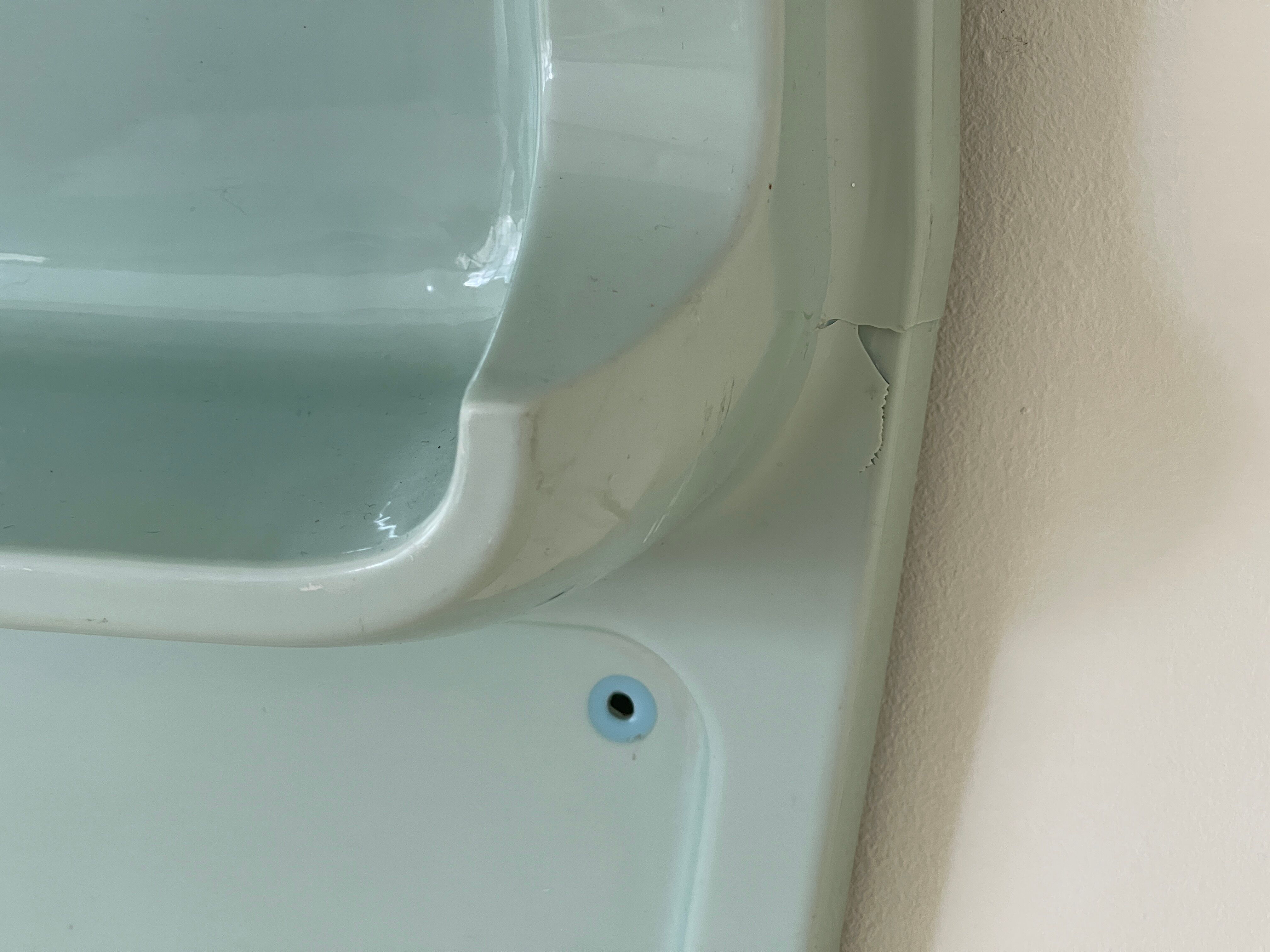 Baby blue plastic mirror and wash station