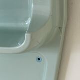 Baby blue plastic mirror and wash station