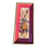 Frame containing dried flowers