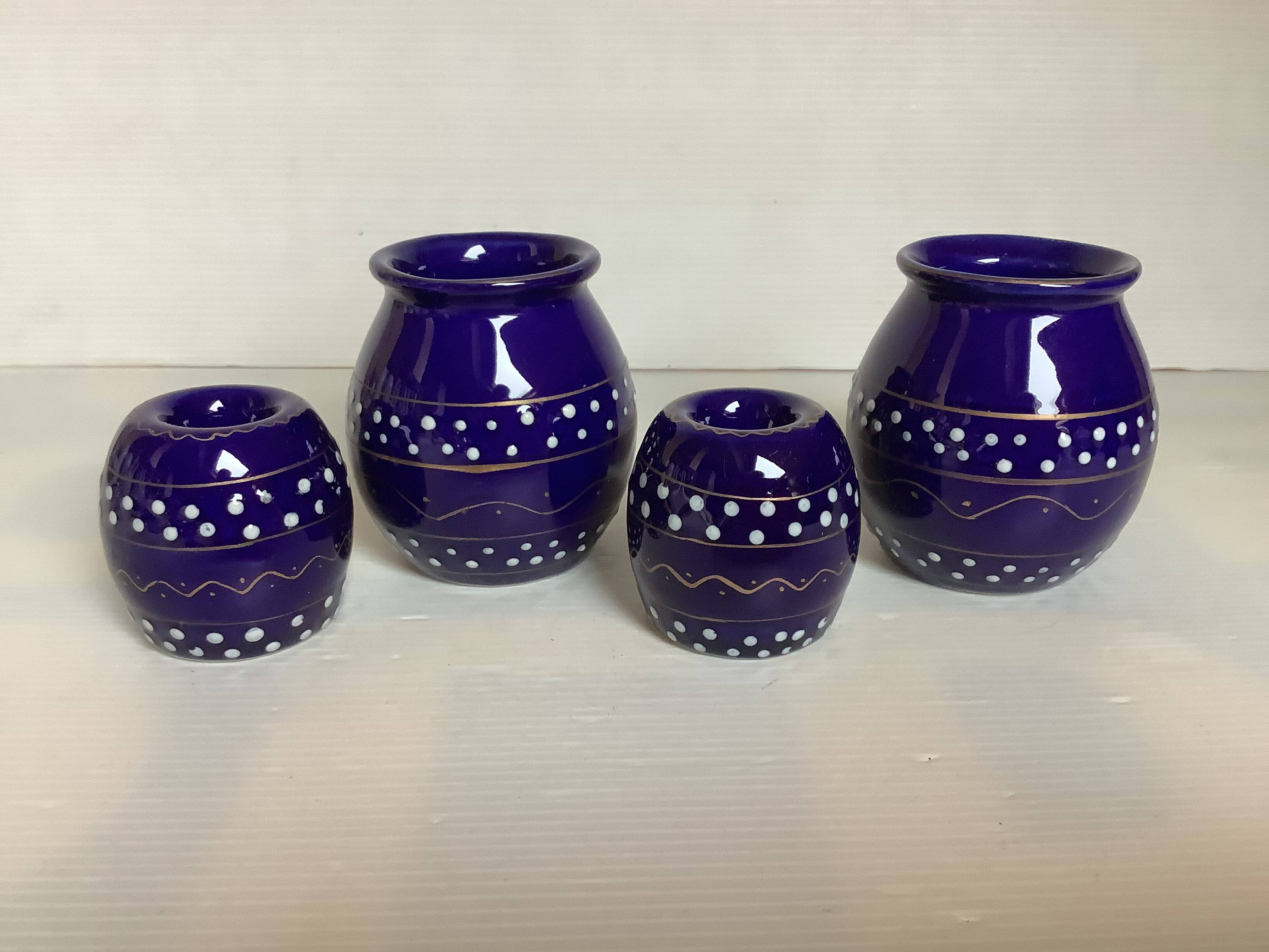 Pair of small enamelled cobalt blue candlesticks and vases