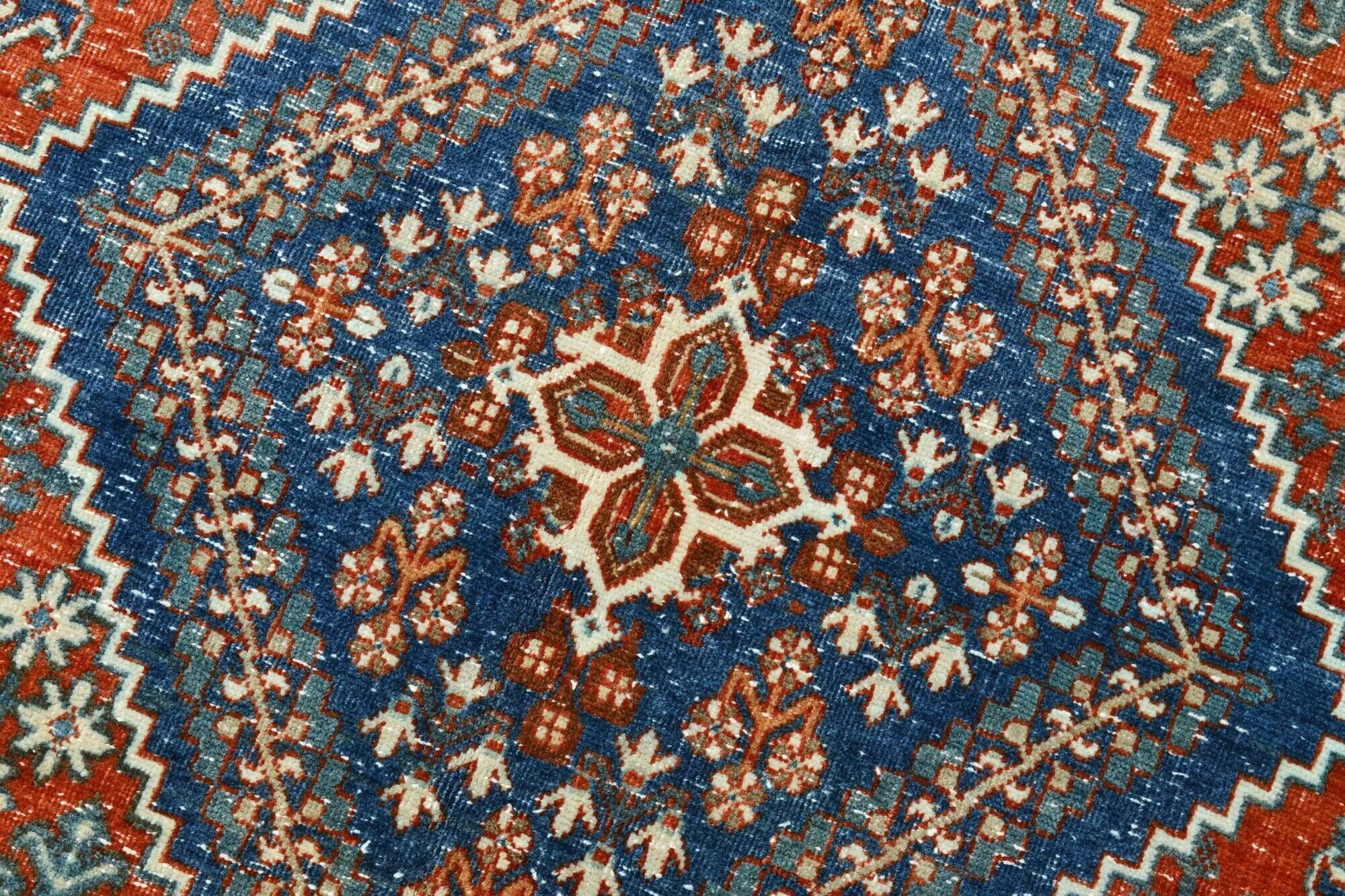 Vintage Turkish rug in brick red and indigo with floral design, 276 × 389 cm