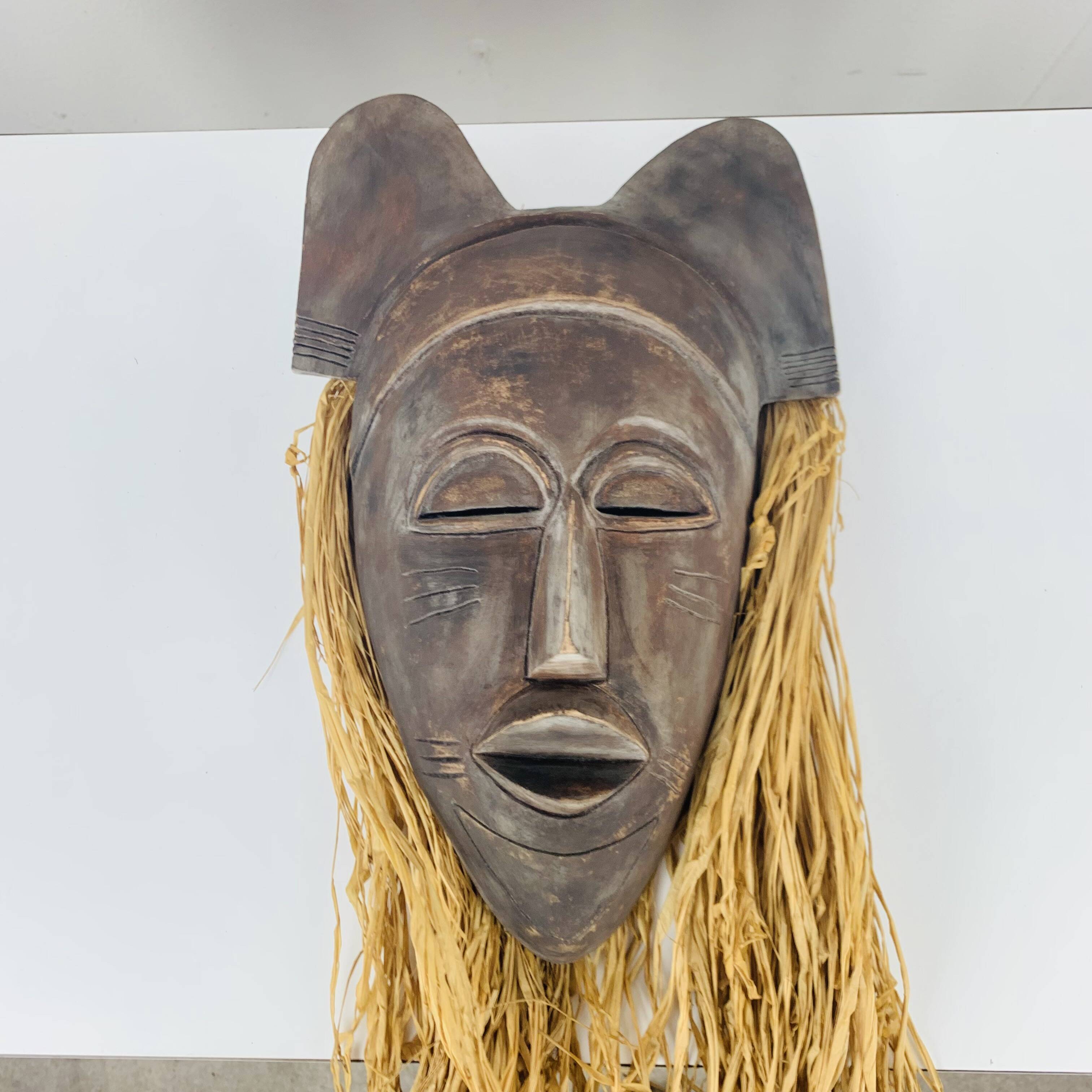 African ceramic and raffia mask signed BJ