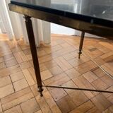 Black marble coffee table with brass legs.