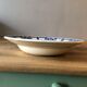 Round dish in ancient earthenware