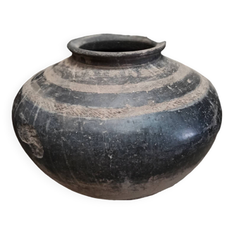 Old black terracotta pot