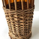 Amber and wicker glass bottle
